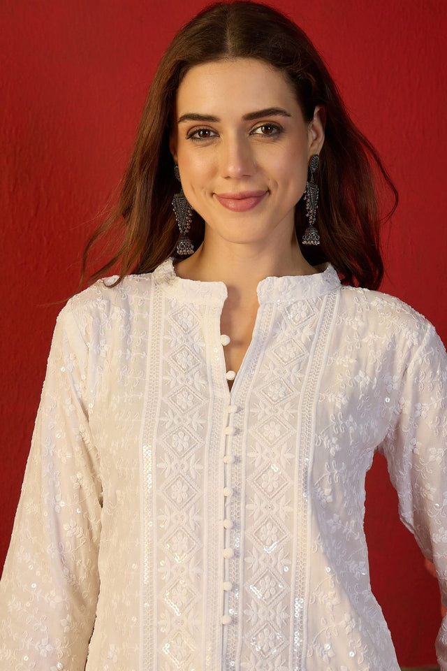 Off White Floral Embroidered Rayon Free Size Stitched Top (52509)