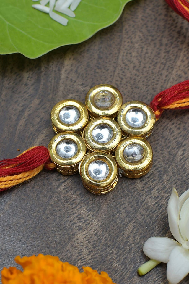 Kundan Floral Gold Tone Kundan Rakhi With Red Yellow Cotton Thread