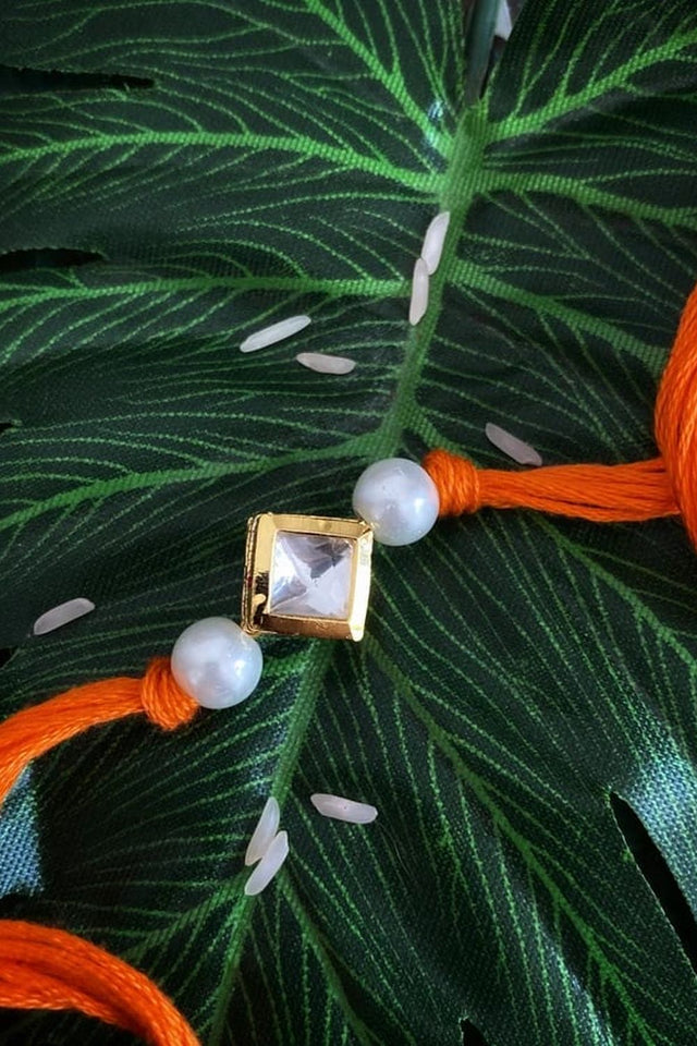 Orange Pearl Gold Tone Kundan Rakhi