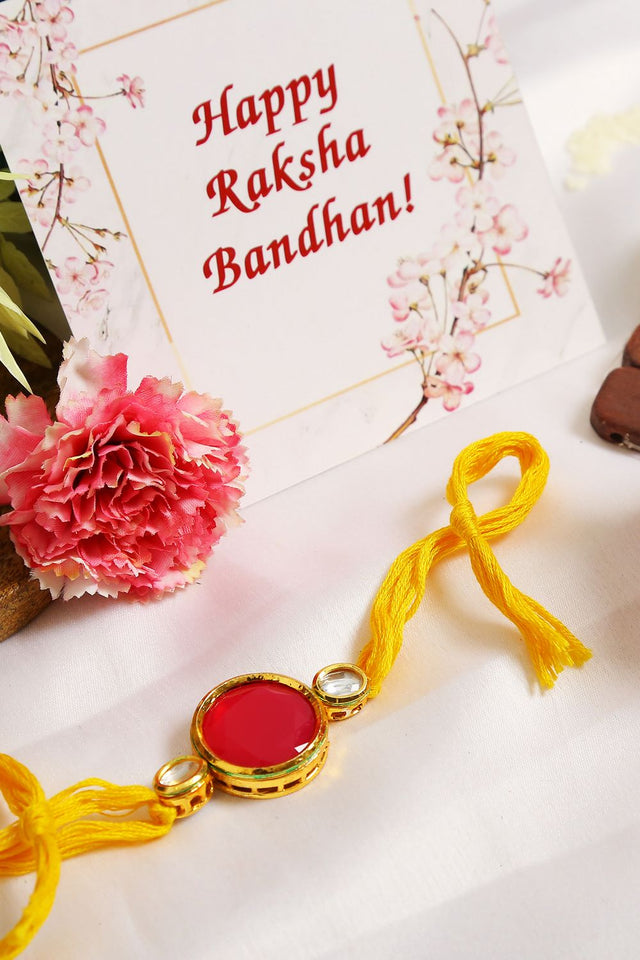 Red Gold Tone Kundan Rakhi With Yellow Thread