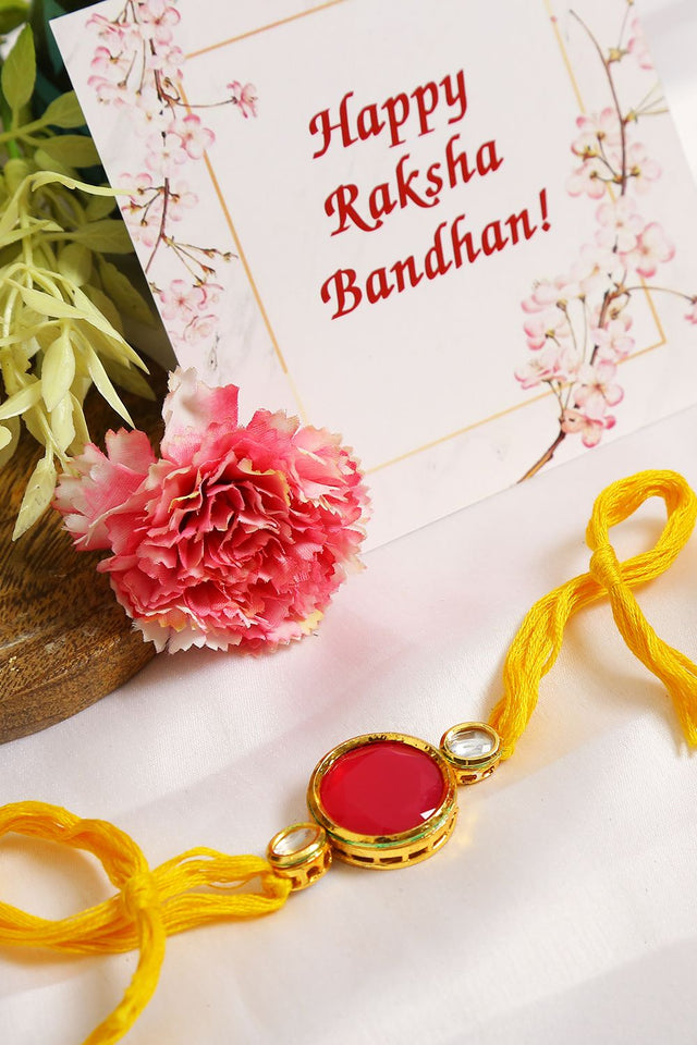 Red Gold Tone Kundan Rakhi With Yellow Thread