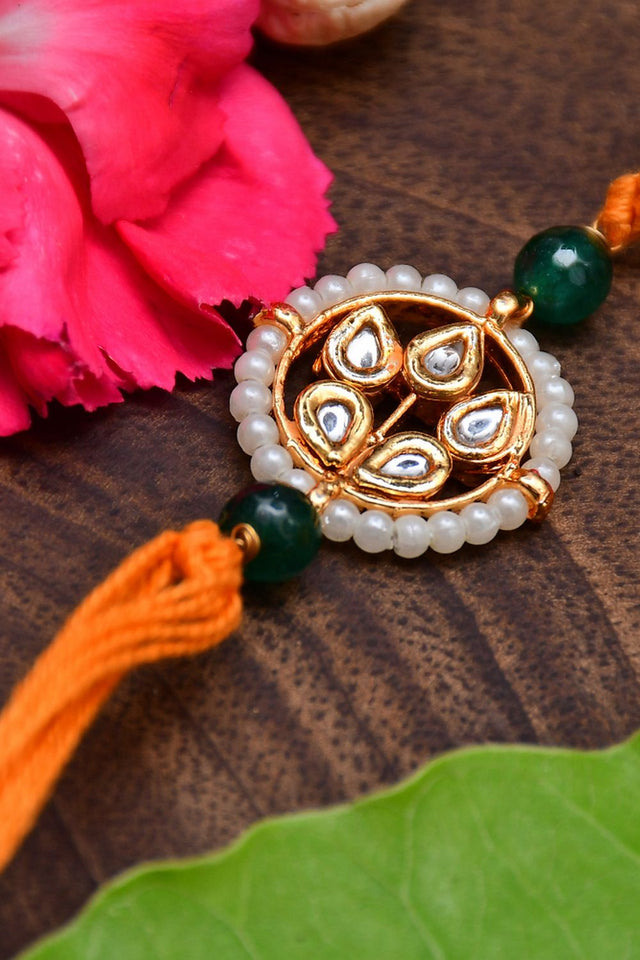 Kundan Floral Gold Tone Kundan Rakhi With Organish Yellow