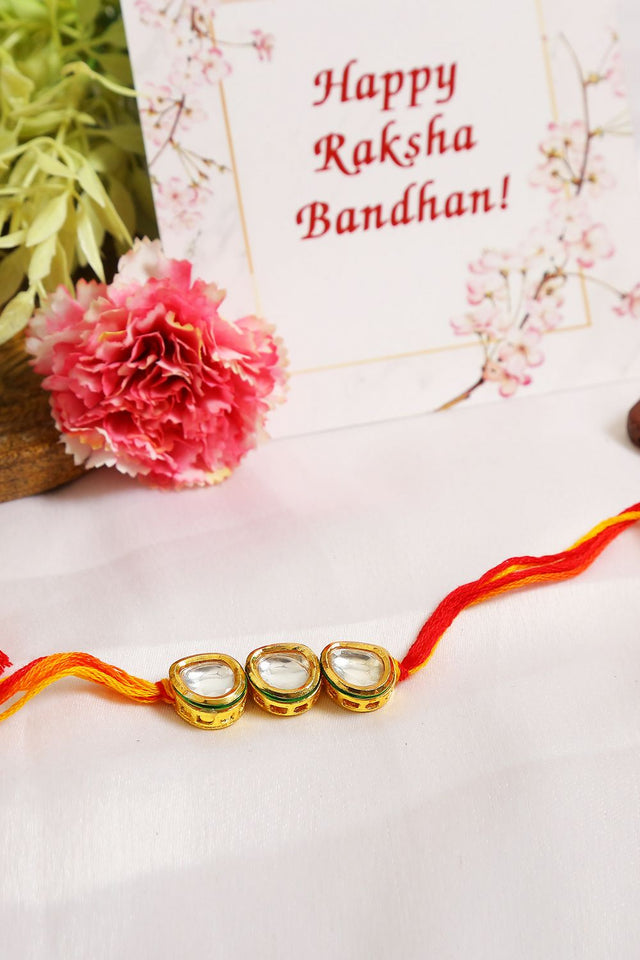 Gold Tone Kundan Rakhi With Red Yellow Cotton Thread