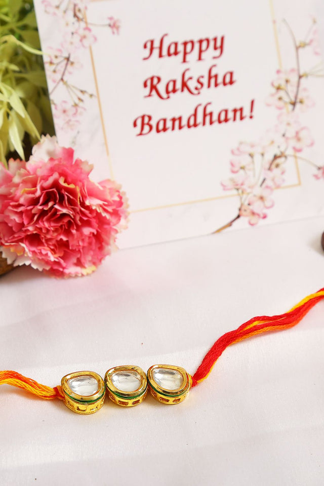Gold Tone Kundan Rakhi With Red Yellow Cotton Thread