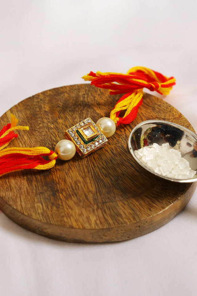 High Quality Kundan Studded Rakhi With Yellow Cotton Thread