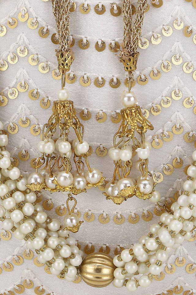 Off White And Gold Georgette Sequined Tasseled Potli