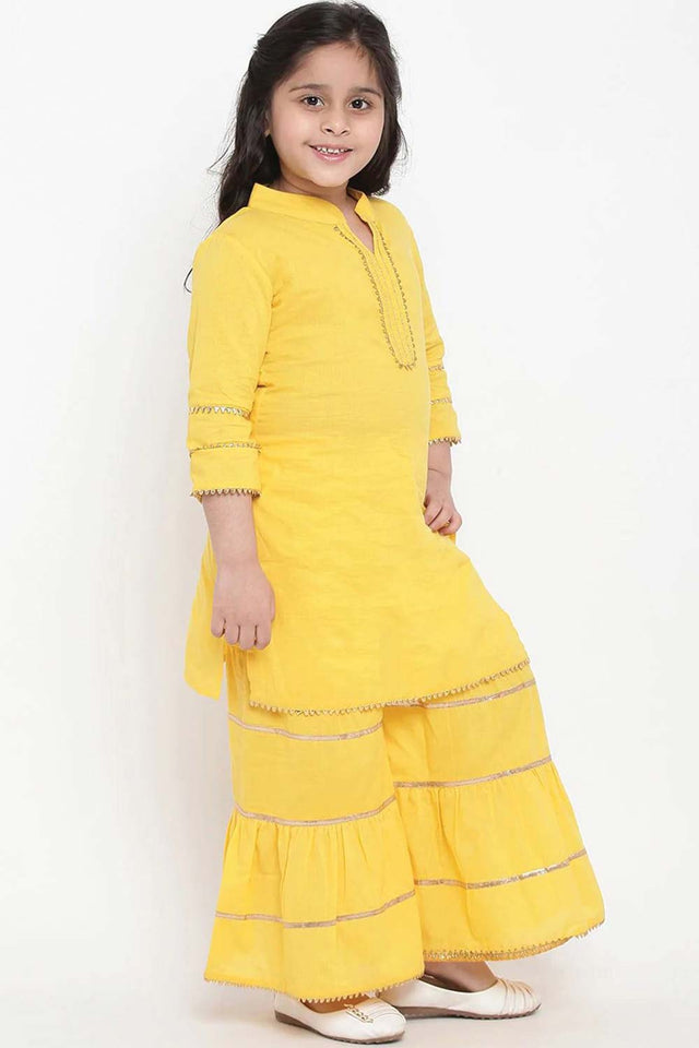 Buy Girl's Yellow And Pink Solid Kurti With Palazzos And Dupatta Online - Front